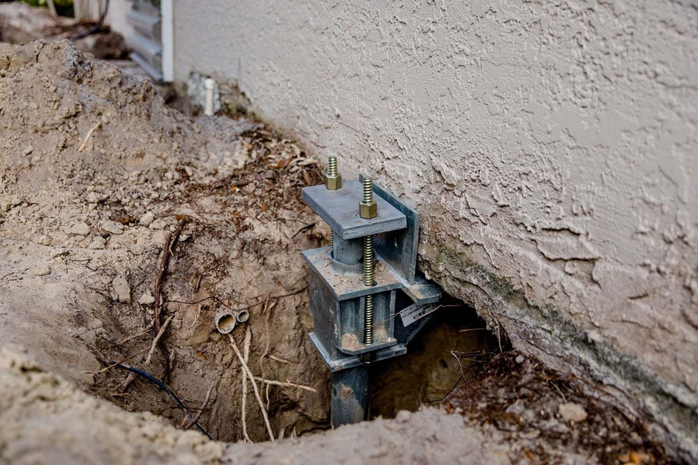 installing foundation piers is the most reliable way to resolve problems caused by differential foundation settlement. Foundation piers come in two primary forms, push and helical, which serve the same purpose but have different installation methods.